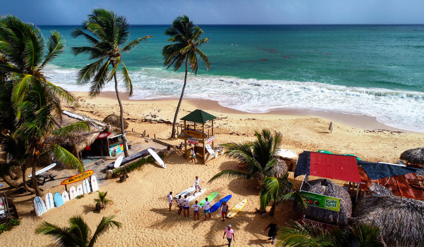Playa Macao natural beach near Punta Cana with waves and palm trees