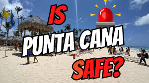 Safe tourist resort area in Punta Cana with beach and palm trees
