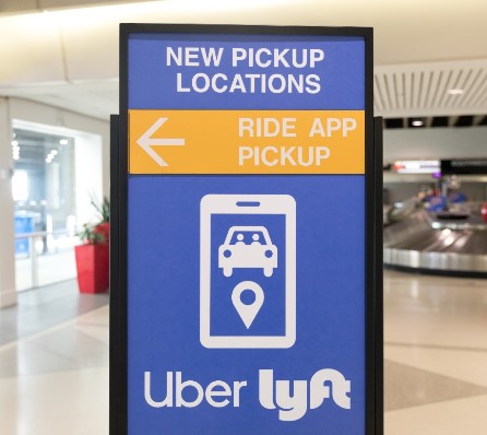 Traveler comparing Uber taxi and private transfer at Punta Cana airport